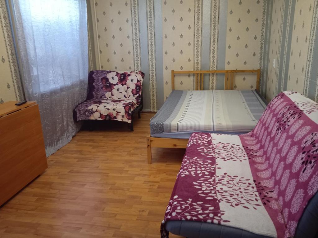 Кровать или кровати в номере Apartment on Levchenko 8