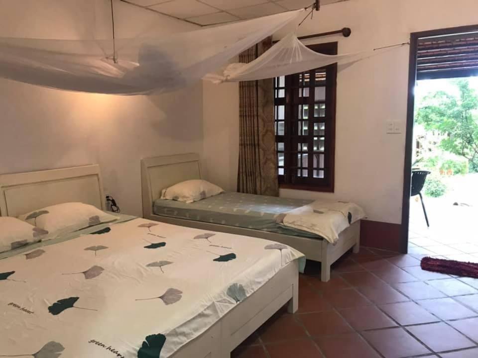 Postel nebo postele na pokoji v ubytování Phu Quoc Kim - Bungalow On The Beach