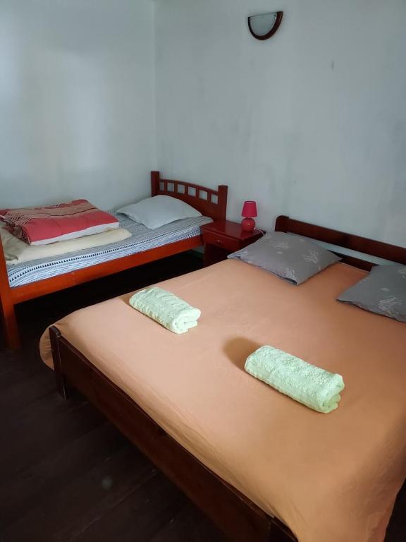Postel nebo postele na pokoji v ubytování Gite Ti Case Lontan