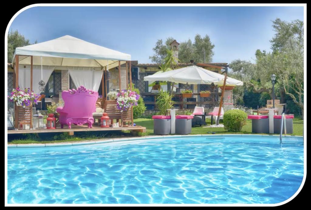 a swimming pool with a gazebo and a house at Villa di Lago Albano - Castel Gandolfo in Albano Laziale
