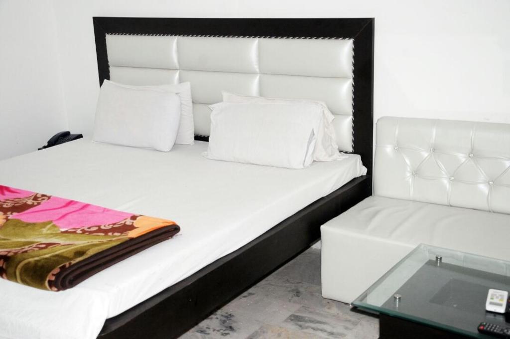 Ένα ή περισσότερα κρεβάτια σε δωμάτιο στο Vamoose Ishaan