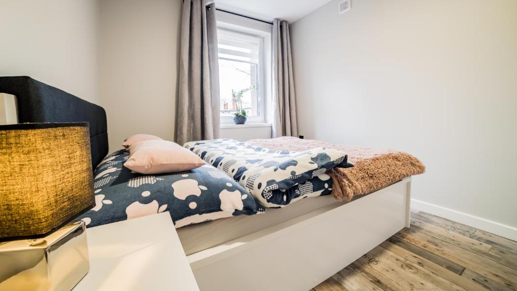 Posteľ alebo postele v izbe v ubytovaní Apartamenty Silvana