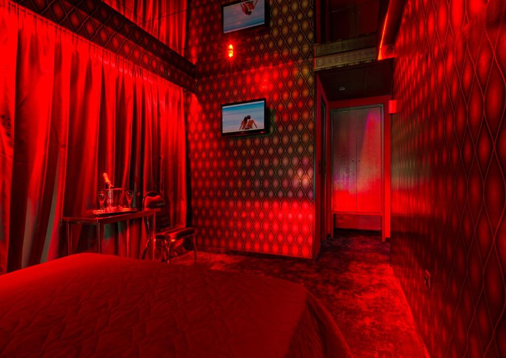 TV a/nebo společenská místnost v ubytování ALFA HOTEL