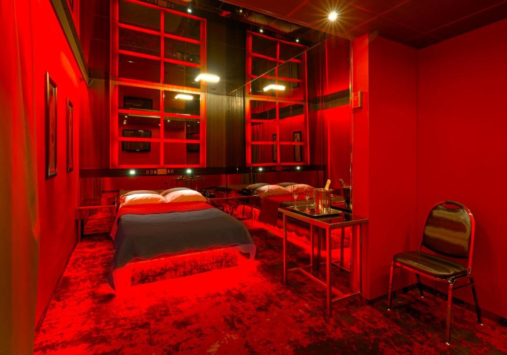 Postel nebo postele na pokoji v ubytování ALFA HOTEL