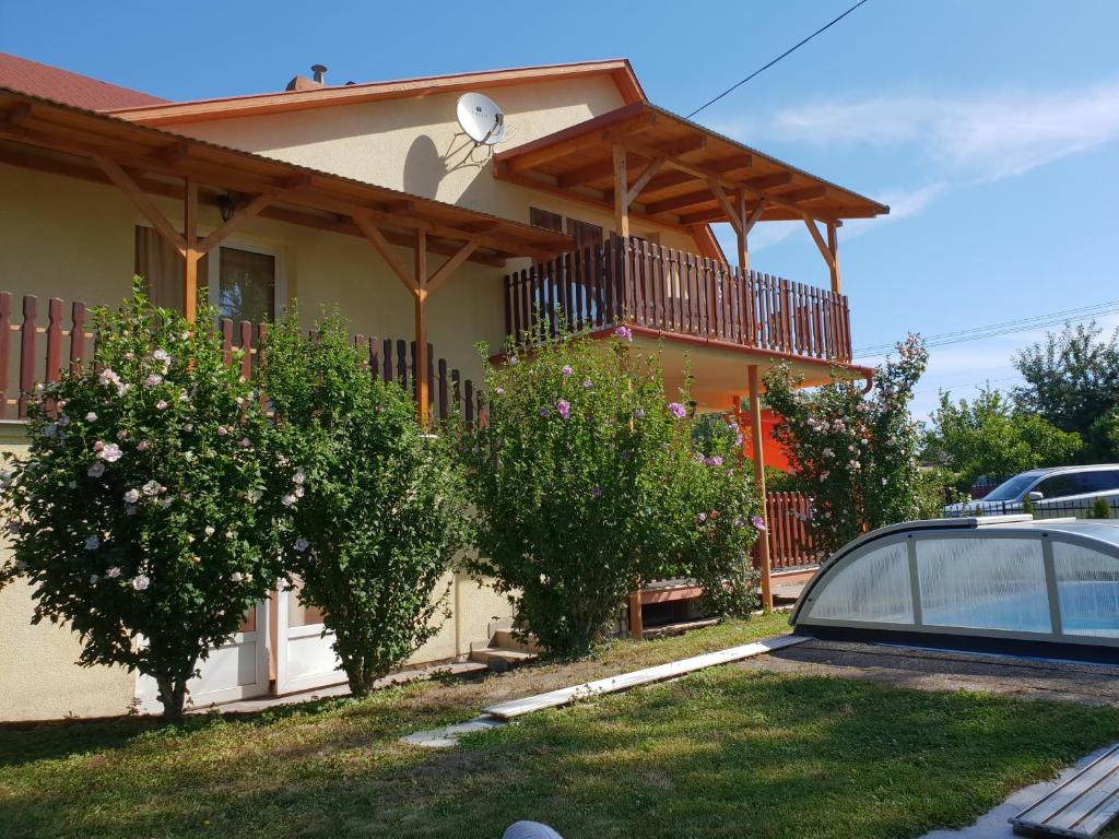 a house with a car parked in front of it at Ferienhaus Alexandra in Balatonberény