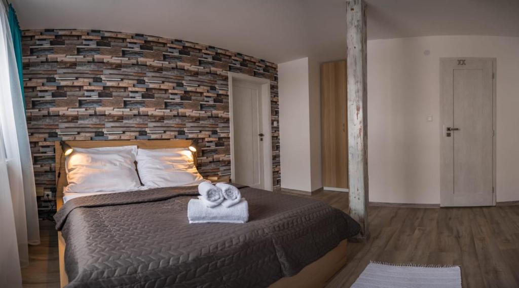 Postel nebo postele na pokoji v ubytování Apartmány Habovka