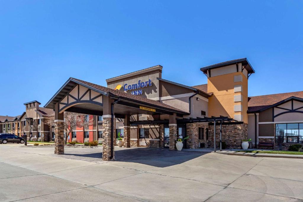 a building with a sign on the front of it at Comfort Inn Grand Island North in Grand Island