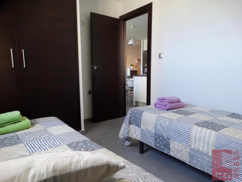 A bed or beds in a room at Apartamento Bella Vista - Aqua Nature La Mata