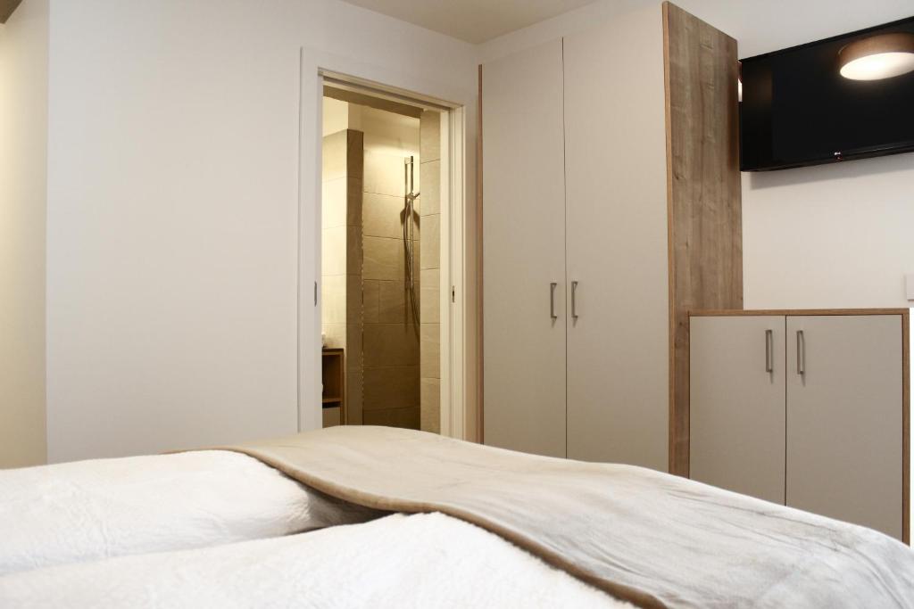 Postel nebo postele na pokoji v ubytování Apartments Rainer