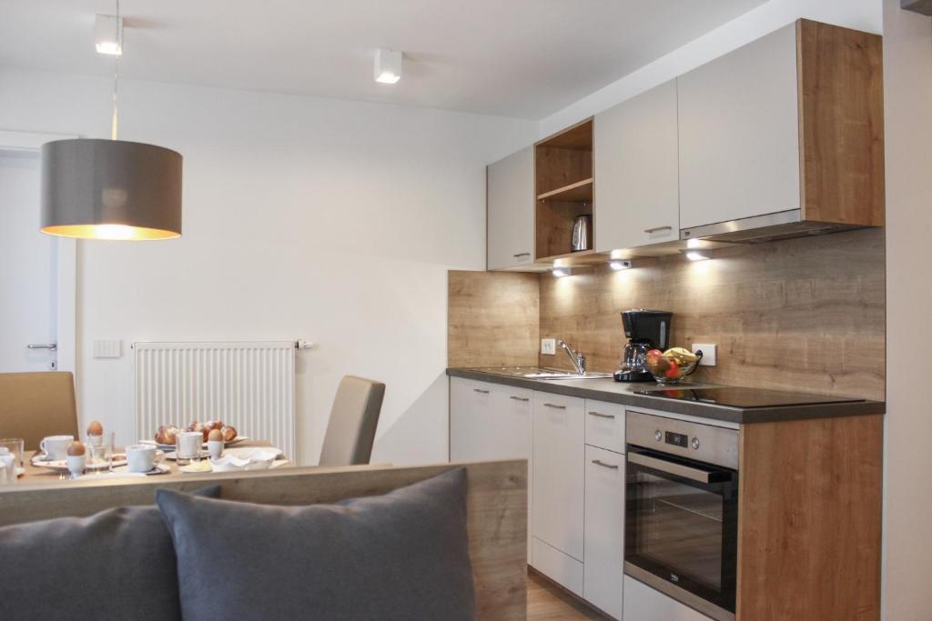 Kuchyň nebo kuchyňský kout v ubytování Apartments Rainer
