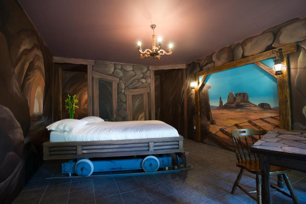 Säng eller sängar i ett rum på Guest house Western-city