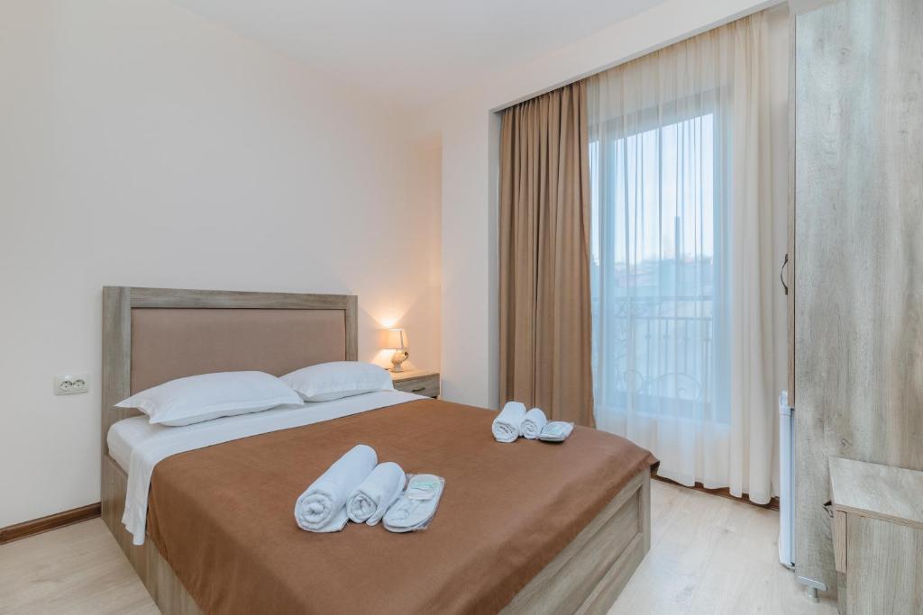 Postel nebo postele na pokoji v ubytování Gala Boutique Hotel