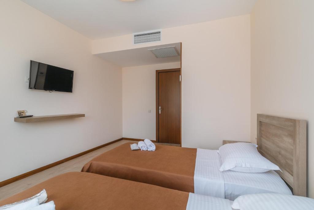 Postel nebo postele na pokoji v ubytování Gala Boutique Hotel