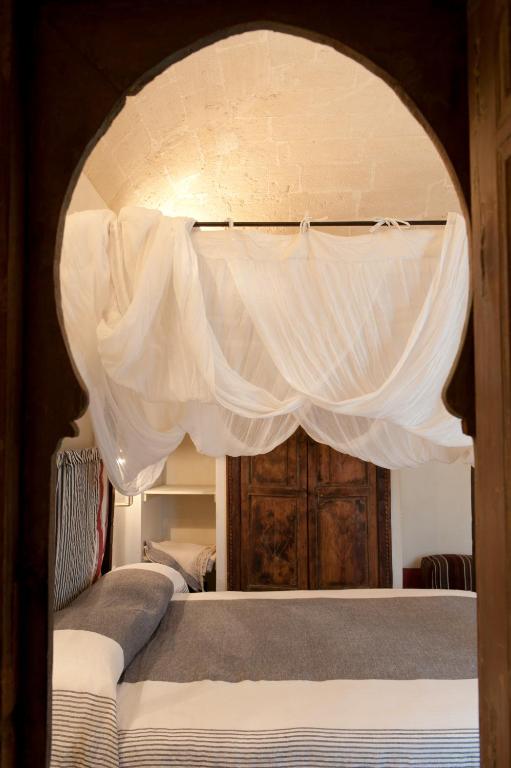 Postel nebo postele na pokoji v ubytování La Casa Dell'Arancio