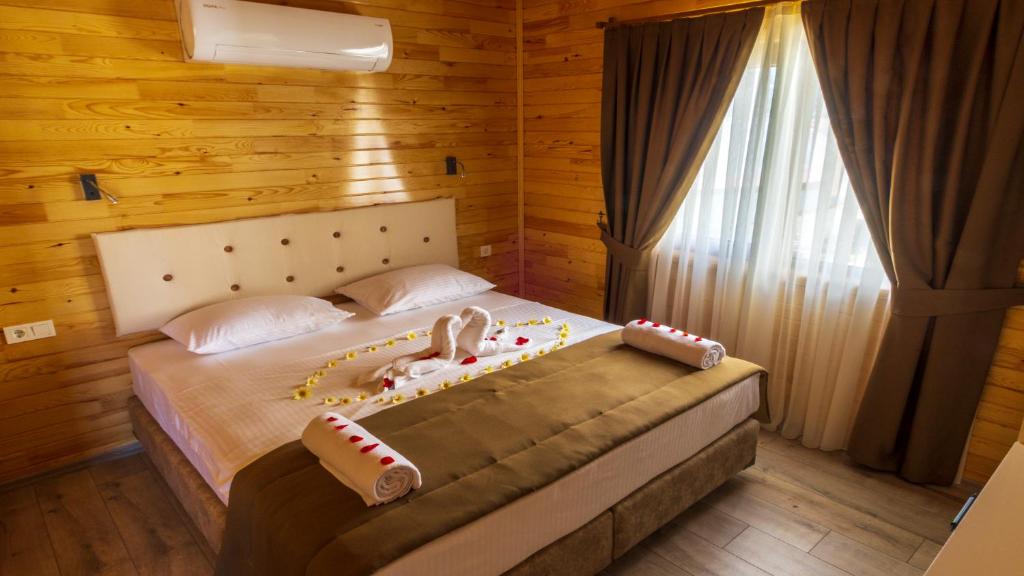 Кровать или кровати в номере MARTI BUNGALOW