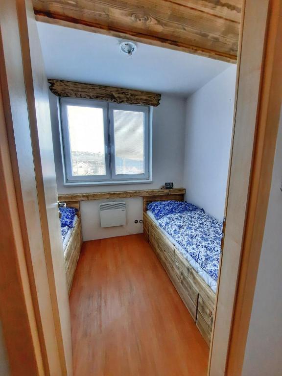 Postel nebo postele na pokoji v ubytování Apartmán Marie