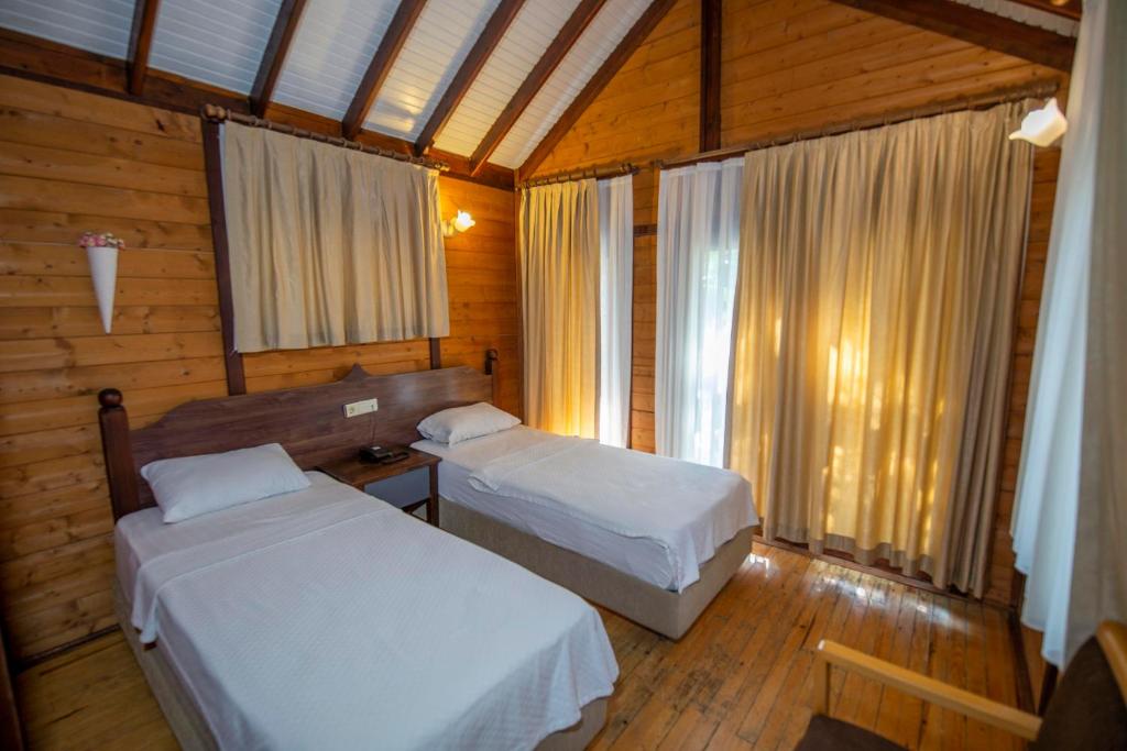 Säng eller sängar i ett rum på Sea Valley Lodge