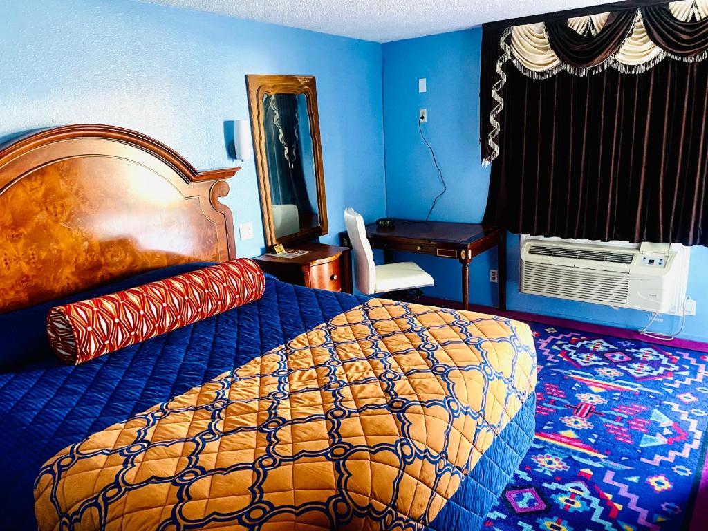 Postel nebo postele na pokoji v ubytování A Fisher's Inn Motel