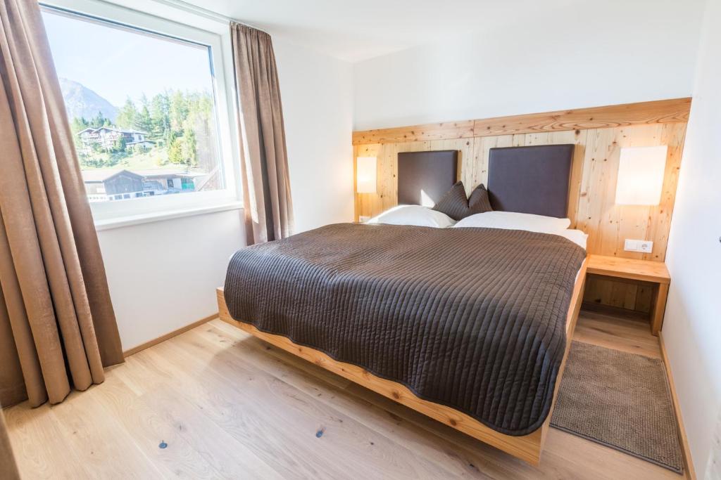 Posteľ alebo postele v izbe v ubytovaní s'Hoamatl Dorfkrug Appartements