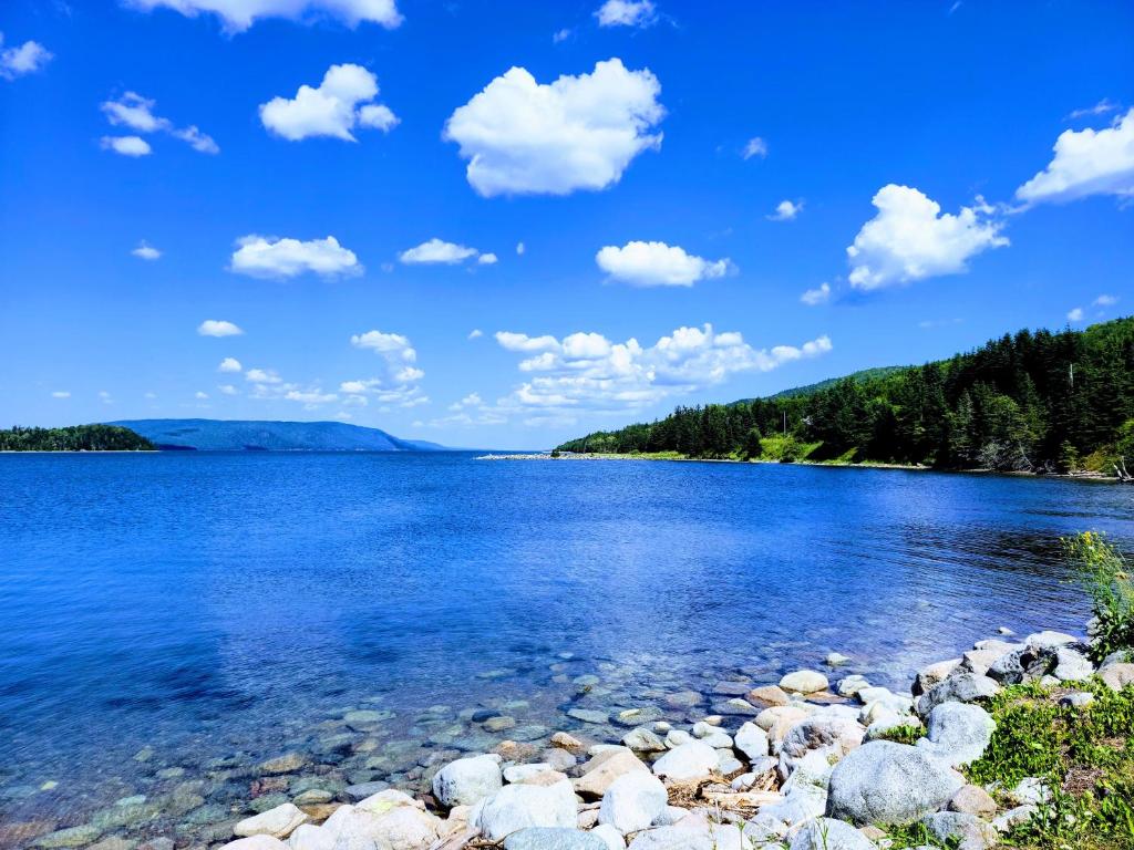 a view of the shore of a lake at St Ann's Motel & Cottage in Baddeck