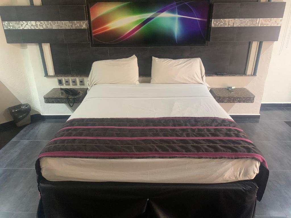 Postel nebo postele na pokoji v ubytování Motel Xcaret