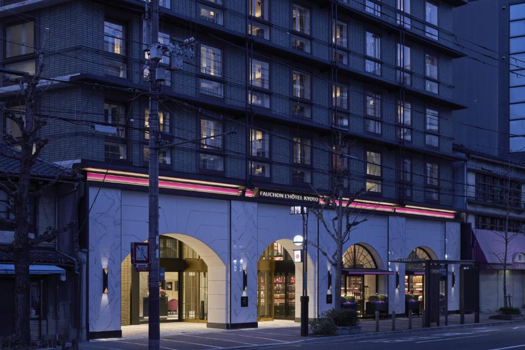 a building on a street with a building at Fauchon Hotel Kyoto - A MEMBER OF THE LEADING HOTELS OF THE WORLD in Kyoto