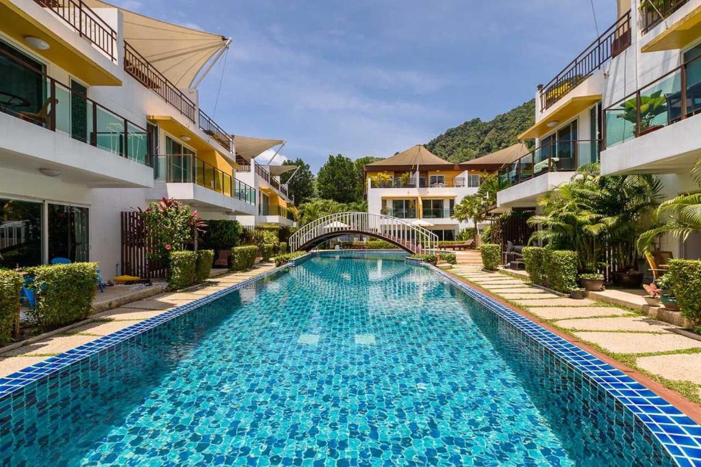 a swimming pool in front of a building at Villa Luxe AP06 in Kamala Beach
