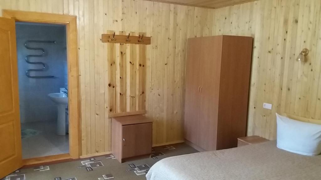 Postel nebo postele na pokoji v ubytování raduga karpat