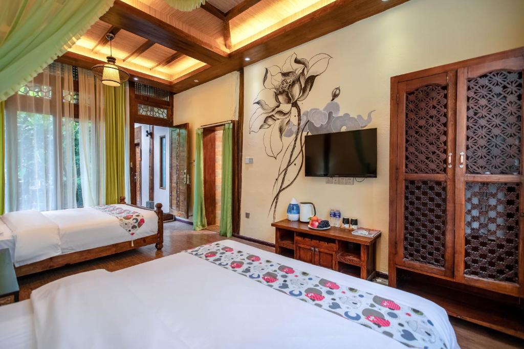 Postel nebo postele na pokoji v ubytování The Ritz-Man Boutique Inn Lijiang