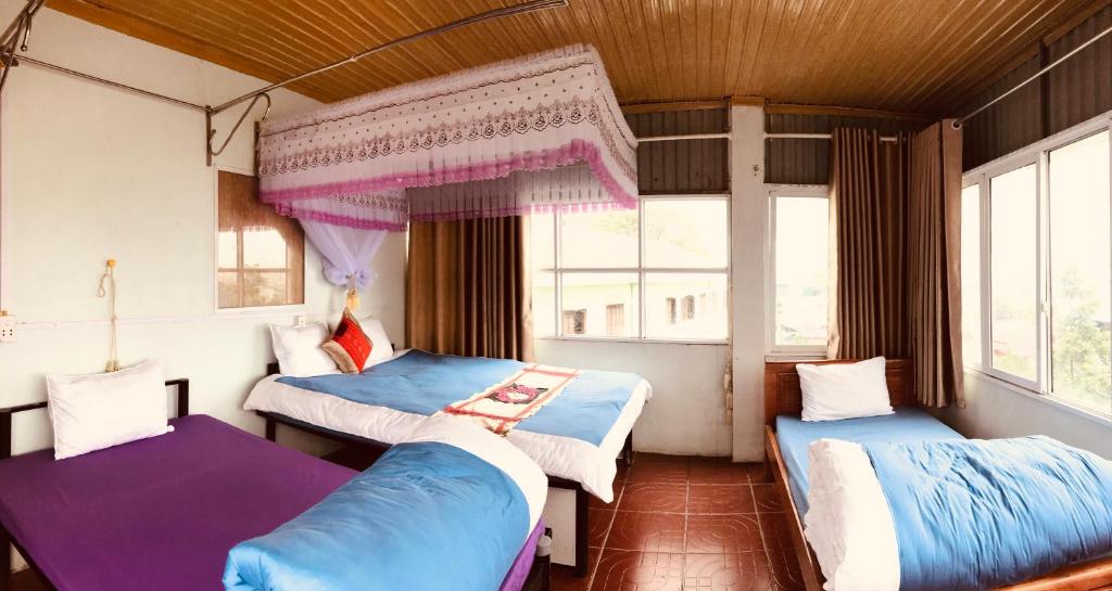 Postel nebo postele na pokoji v ubytování Meo Vac Cosy Hostel
