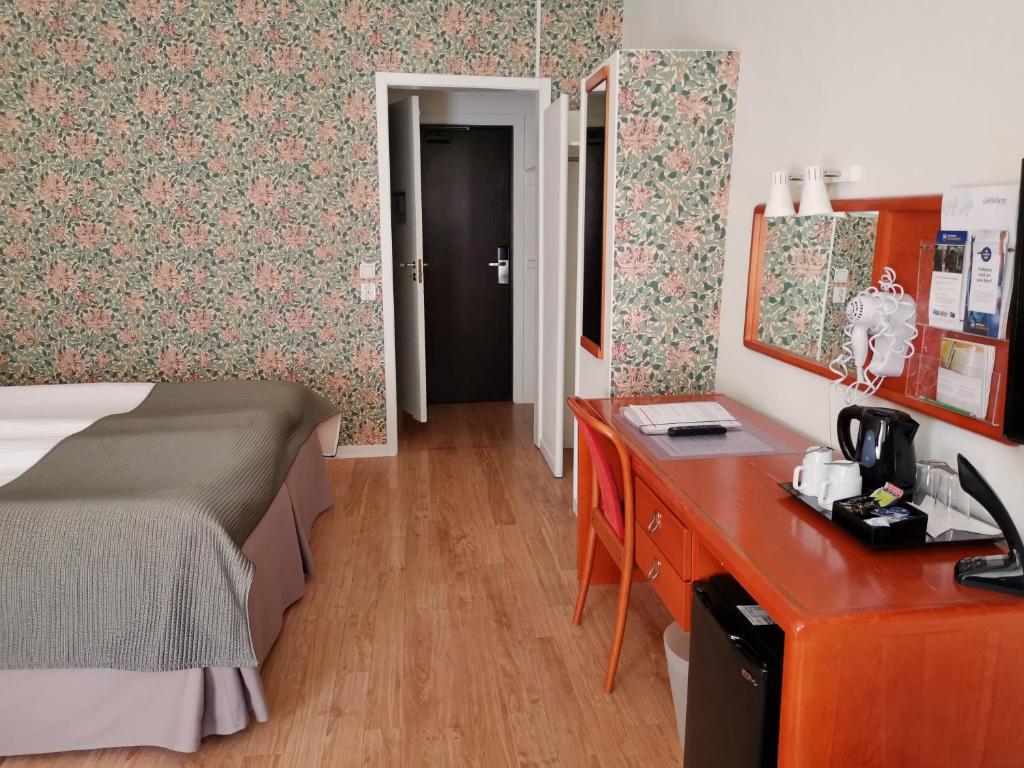 Postel nebo postele na pokoji v ubytování Hotel Lorensberg