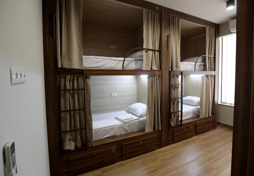 Postel nebo postele na pokoji v ubytování Loft Host Yerevan