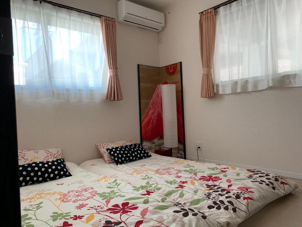 Letto o letti in una camera di Nara Guesthouse Kaede