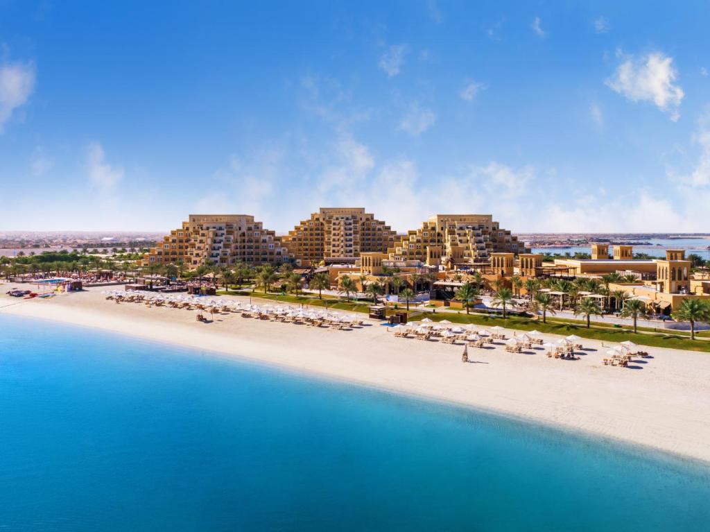 an aerial view of a beach with a resort at Rixos Bab Al Bahr - Ultra All Inclusive in Ras al Khaimah