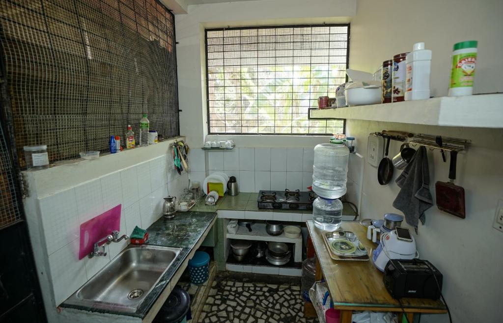 Kuchyň nebo kuchyňský kout v ubytování Adams Cottage Kochi
