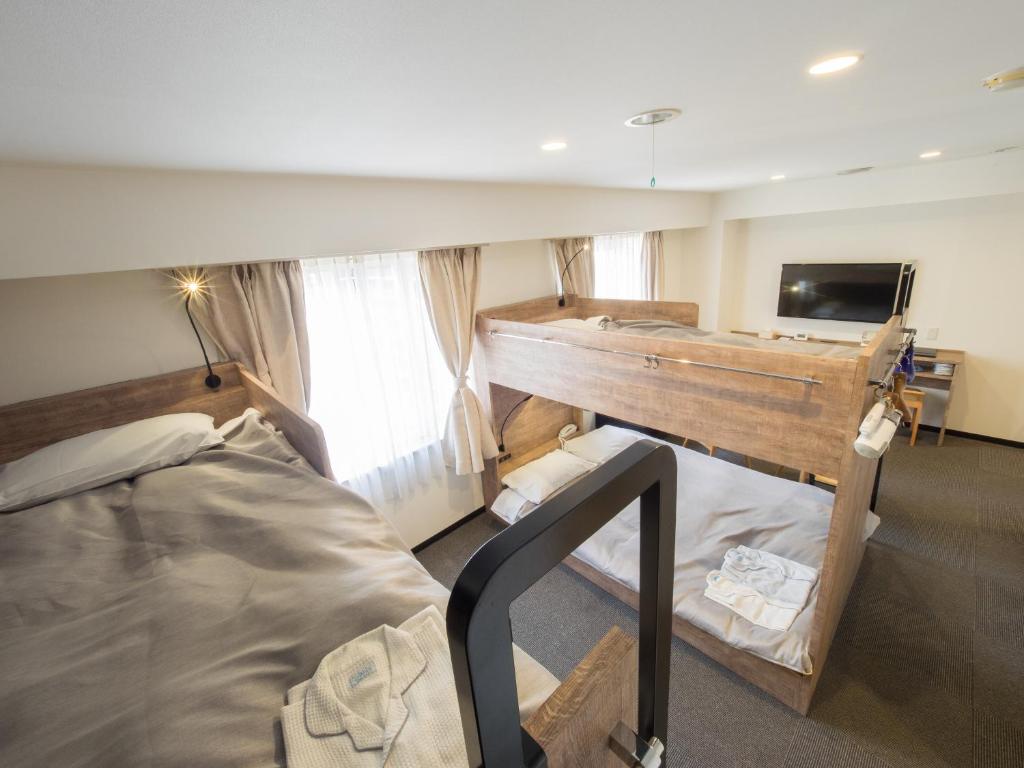 Postel nebo postele na pokoji v ubytování Hotel Shin Osaka