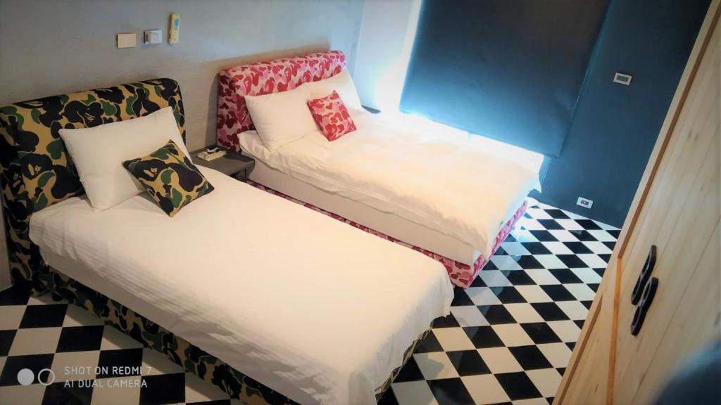 Postel nebo postele na pokoji v ubytování Noah's Ark Homestay