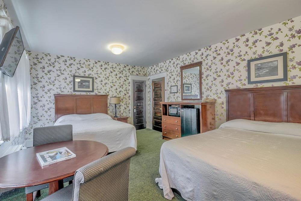 Postel nebo postele na pokoji v ubytování Atlantic Hotel, Inc