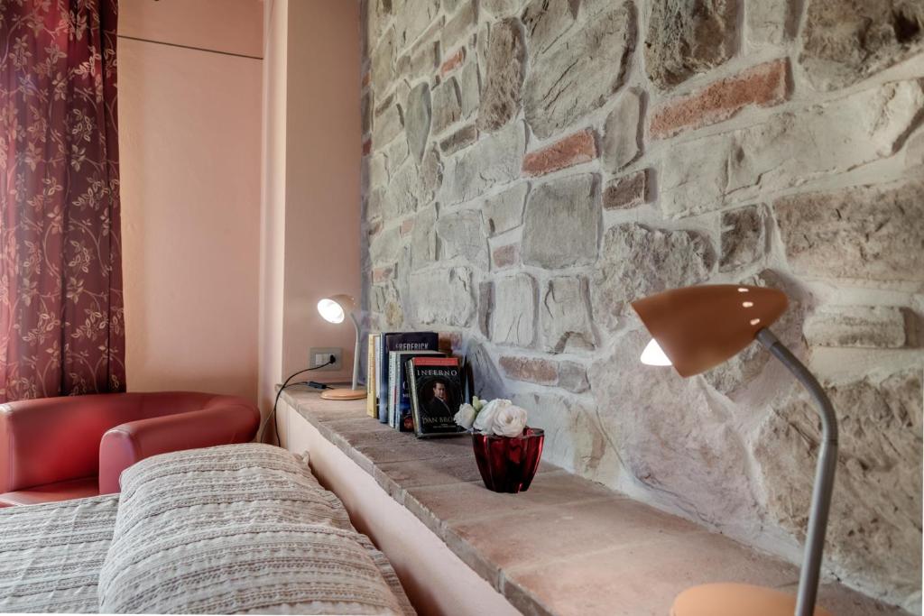 Postel nebo postele na pokoji v ubytování Villa Bellaria Lucignano