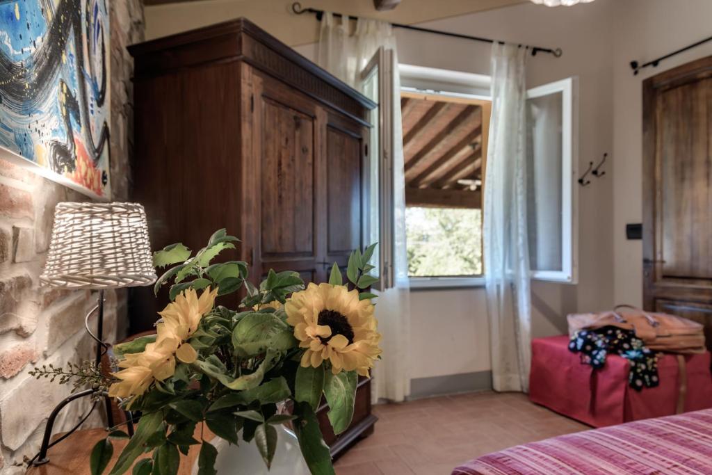 Postel nebo postele na pokoji v ubytování Villa Bellaria Lucignano