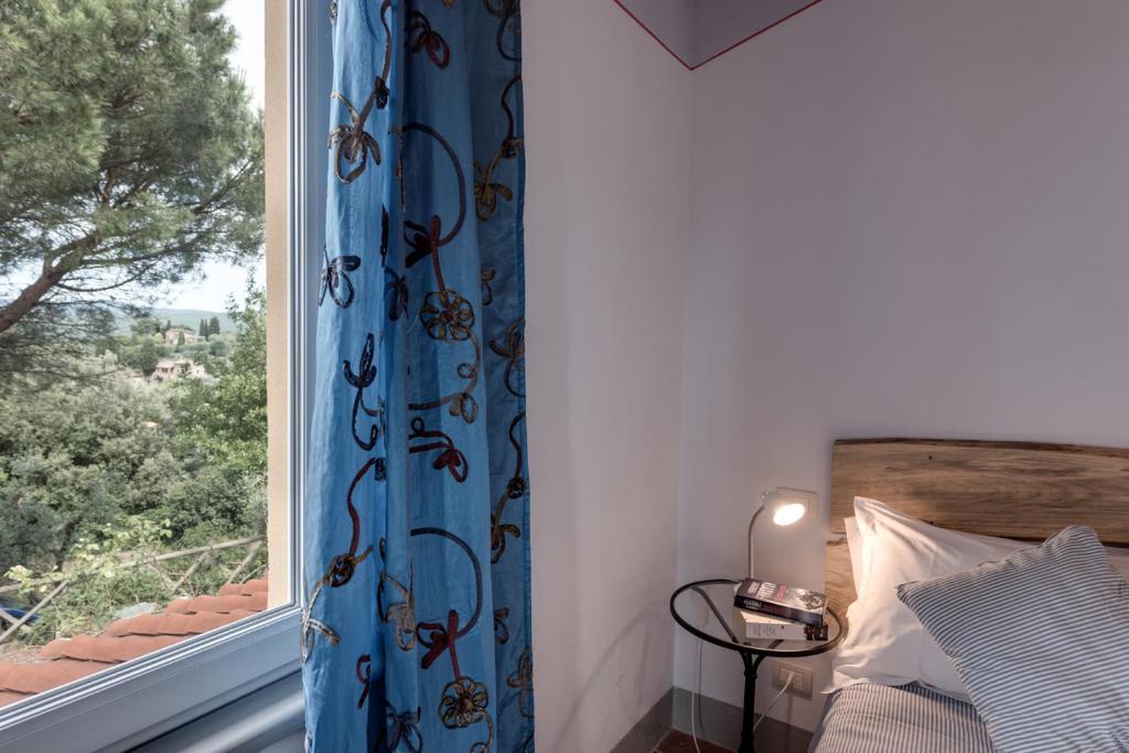 Postel nebo postele na pokoji v ubytování Villa Bellaria Lucignano