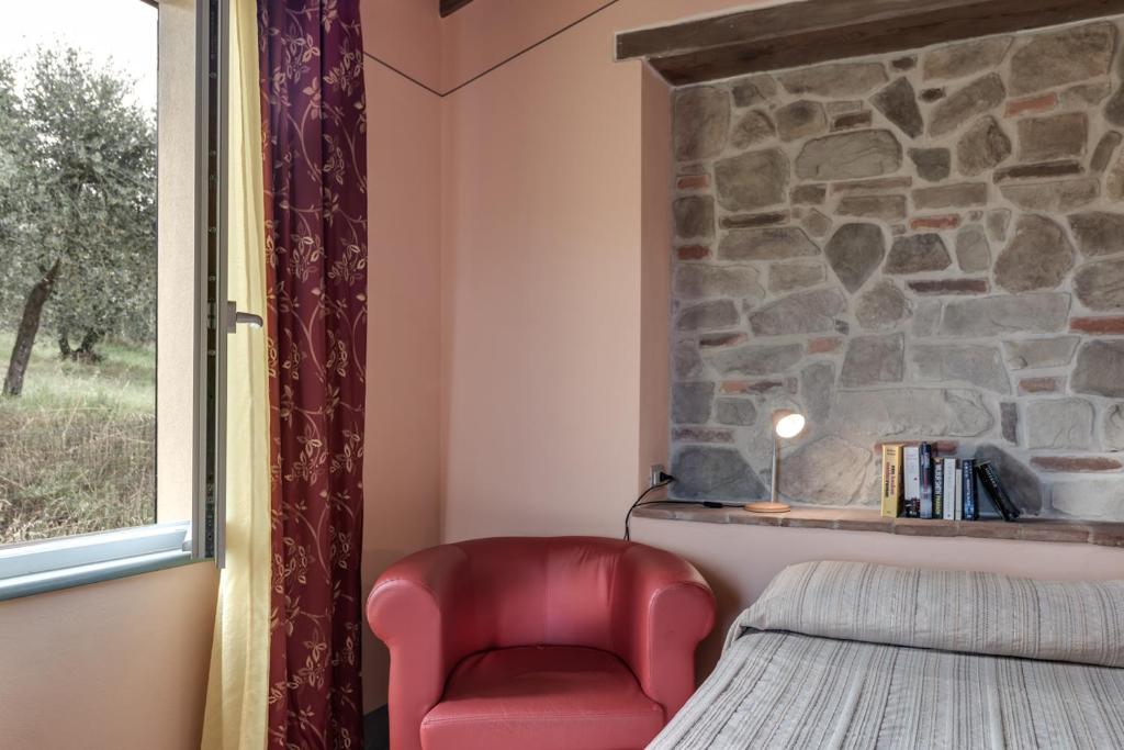 Postel nebo postele na pokoji v ubytování Villa Bellaria Lucignano