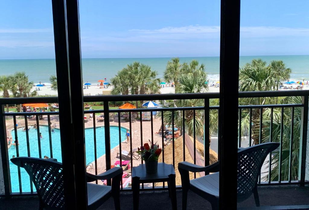 a view of the beach from a hotel room balcony at 354 Beach Daze Oceanfront Great Location in Myrtle Beach