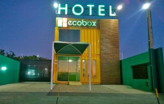 a hotel with a sign on the front of it at Ecobox Hotel in Três Lagoas