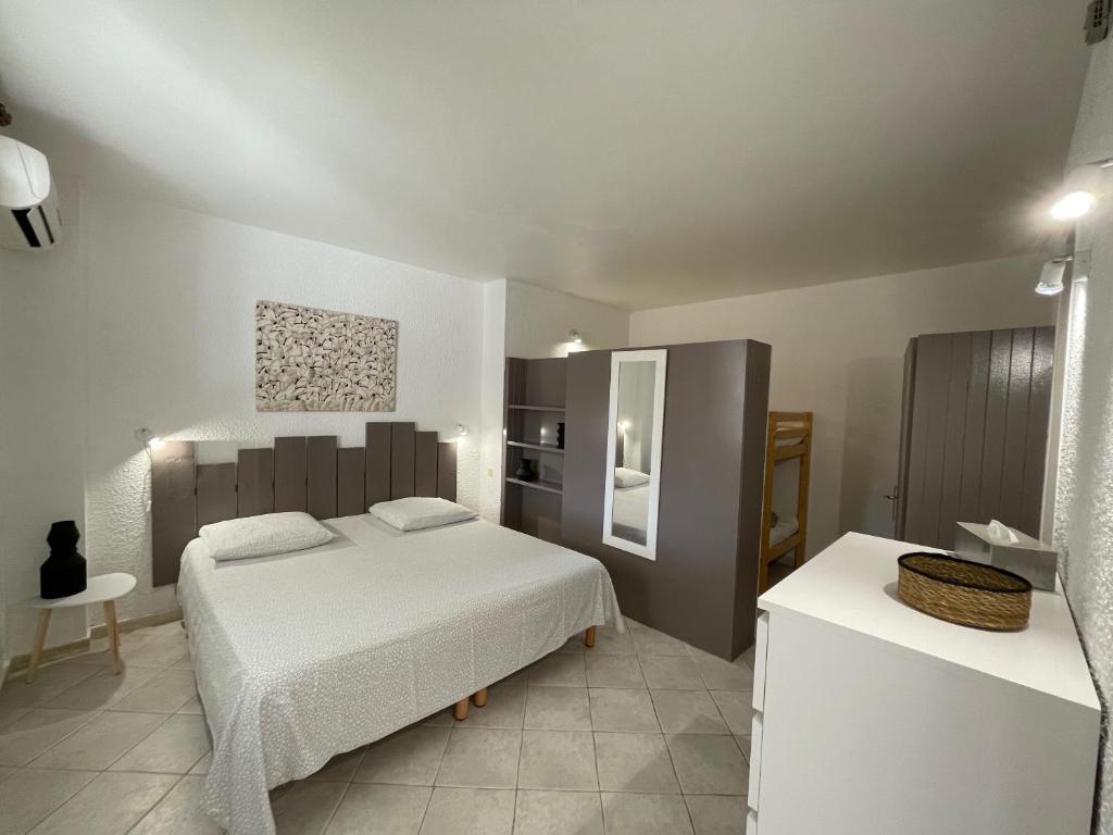 Postel nebo postele na pokoji v ubytování Hotel L'Orangeraie