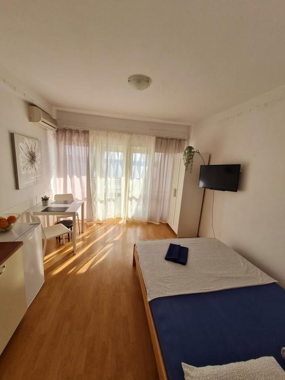 Posteľ alebo postele v izbe v ubytovaní Apartmani E&G