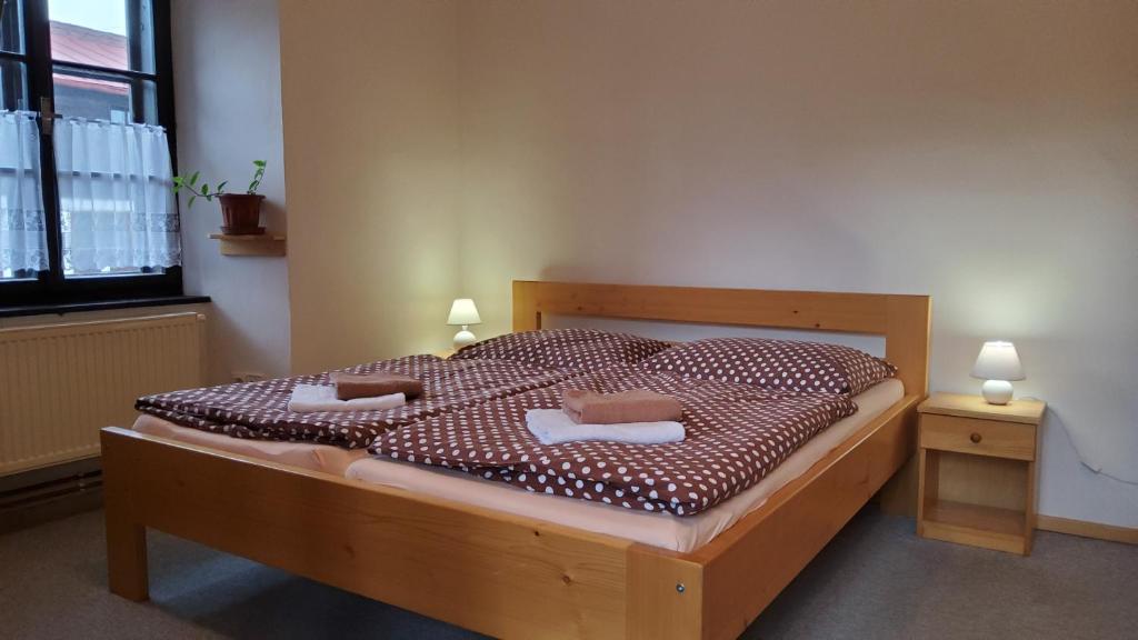Postel nebo postele na pokoji v ubytování Baurů Dvůr
