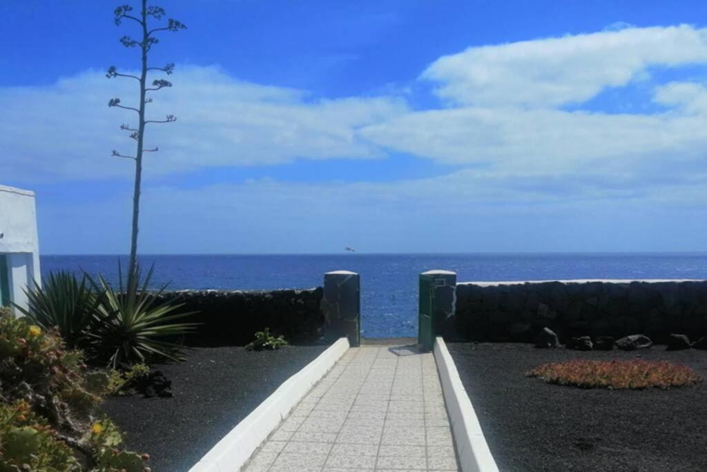 a view of the ocean from a walkway at La Croce dei Venti (VV) in Teguise