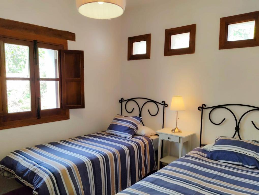 Łóżko lub łóżka w pokoju w obiekcie Villa Huerta Nacimiento