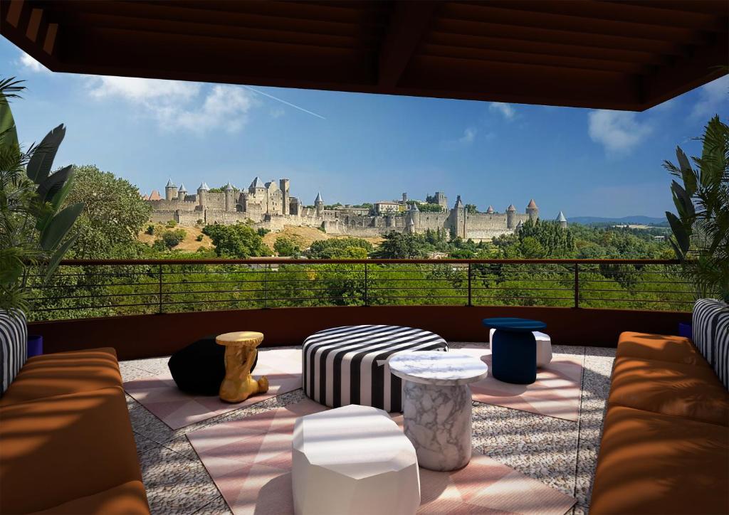 a balcony with a view of a castle at Tribe Carcassonne in Carcassonne
